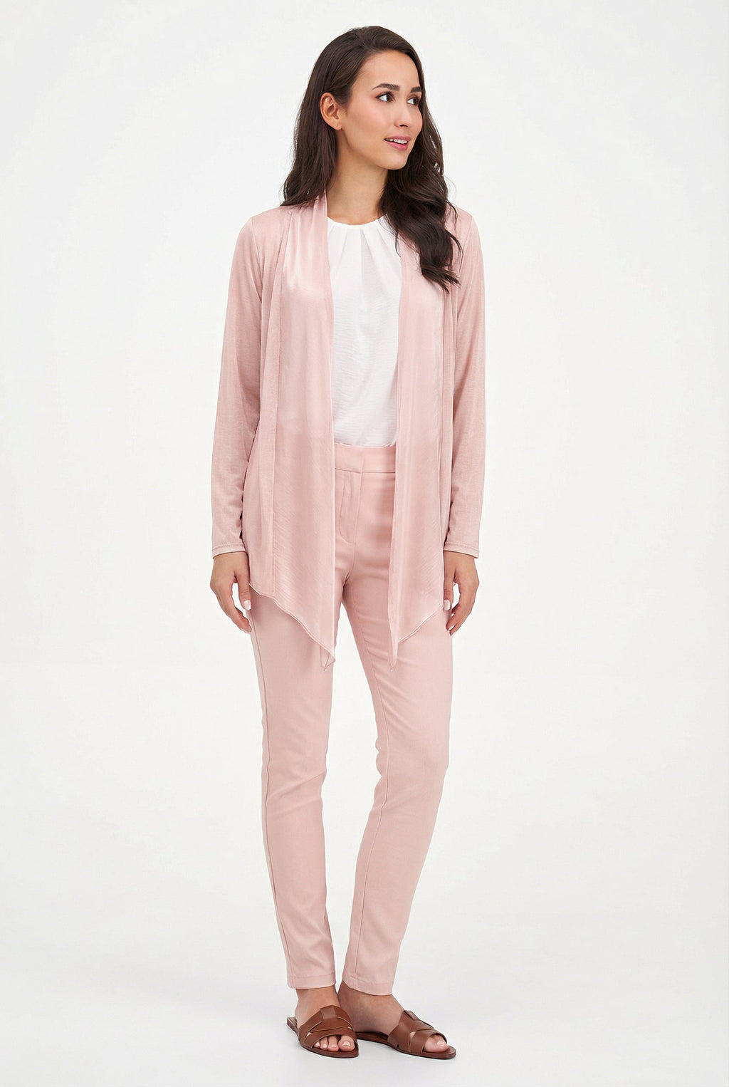 Woman wearing a pink outfit with a white background