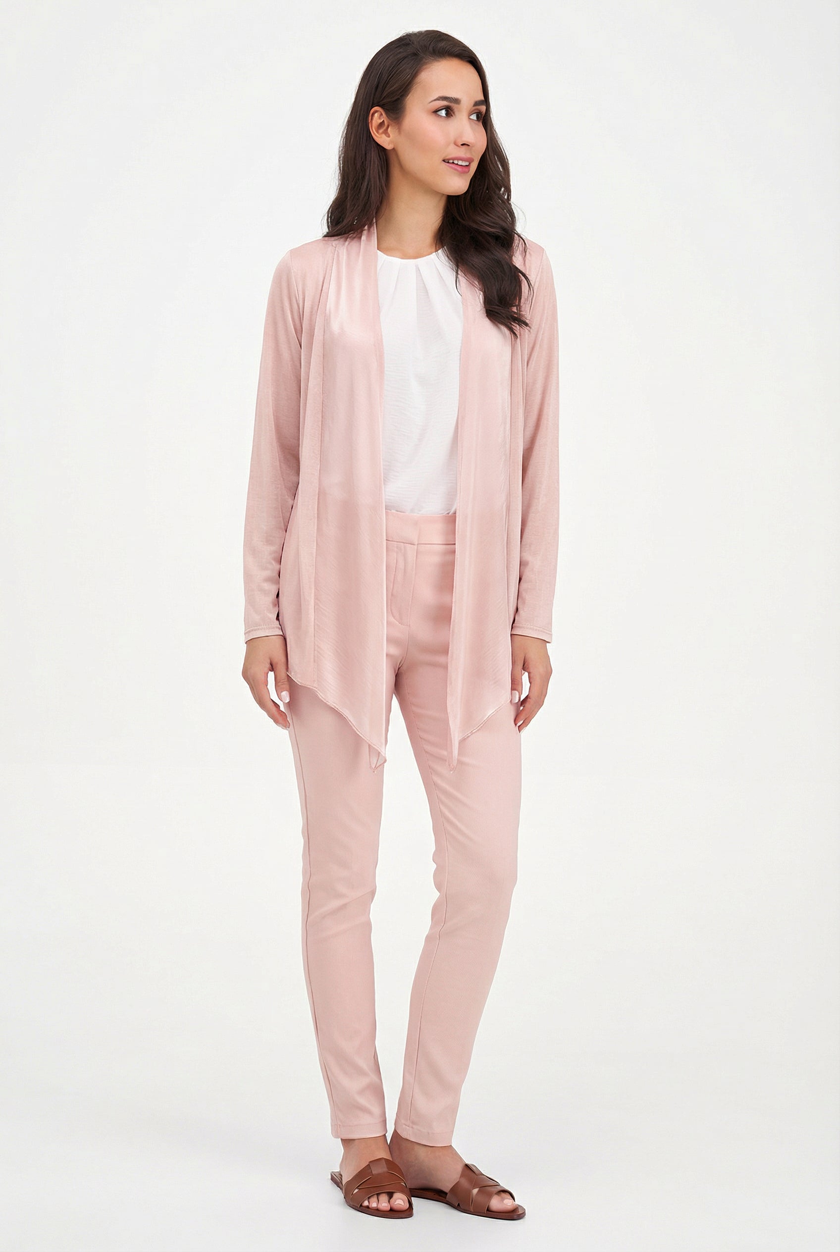 Woman wearing a pink outfit with a white background